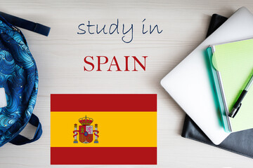 Study in Spain. Background with notepad, laptop and backpack. Education concept.
