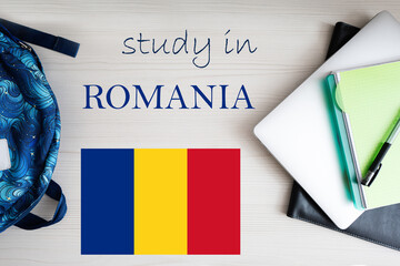 Study in Romania. Background with notepad, laptop and backpack. Education concept.