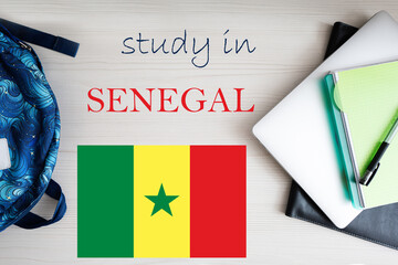 Study in Senegal. Background with notepad, laptop and backpack. Education concept.