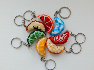 Fruit colorful key chains on a white