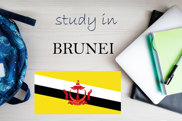 Study in Brunei. Background with notepad, laptop and backpack. Education concept.