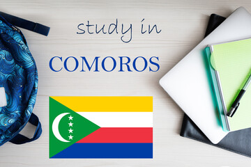 Study in Comoros. Background with notepad, laptop and backpack. Education concept.