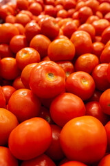 Big pile of tomatoes in a store.
