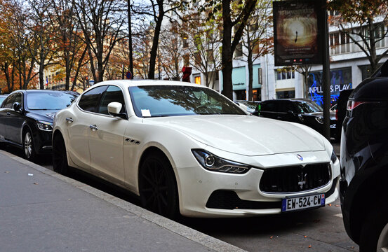 Paris, France - October 24th 2019 : White Maserati Ghibli parked in George V avenue.
