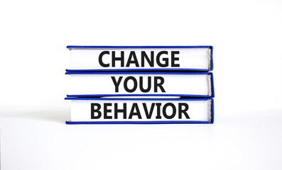Motivation and Change your behavior symbol. Concept words Change your behavior on books on a beautiful white table white background. Business change your behavior concept. Copy space.