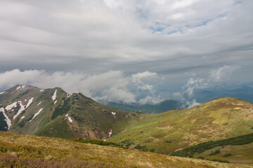 Fototapeta na wymiar Maly Krivan, mountain in Mala Fatra, Slovakia, view from mountain Pekelnik, in spring cloudy day