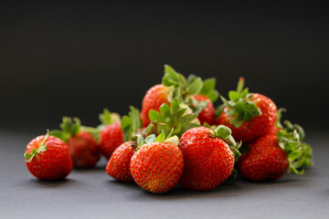 Fresh, red strawberries on a black background
