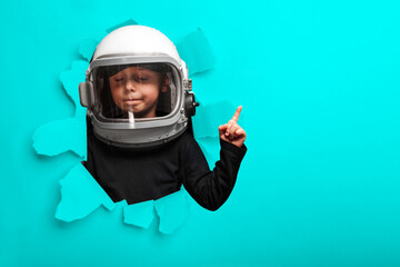 small child imagines himself to be an astronaut