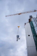 wet concrete bucket use with crane to building construction