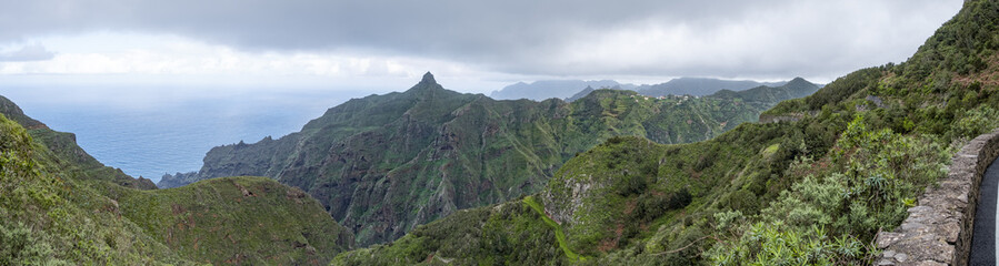 Fototapeta na wymiar Huge panorama landscape of dark green forest in mountains of terenife, in hike path island, canarias, spain
