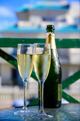Dinner party, drinking of cava or champagne sparkling wine in vacation resort Caleta Fuste, Fuerteventura, Canary islands vacation, Spain