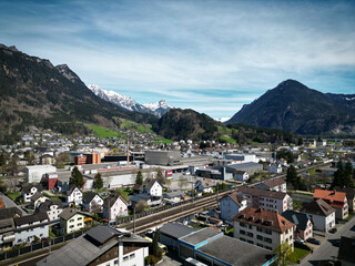 Fototapeta premium view of the city of Bludenz from the air, alpine landscape, spring