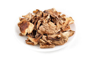 On a white background a plate with dried mushrooms.