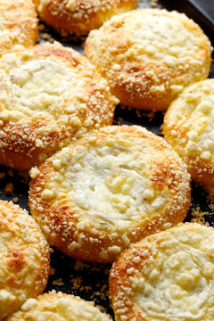 Sweet homemade yeast rolls with addition of vanilla cheese and butter crumble, close up view.