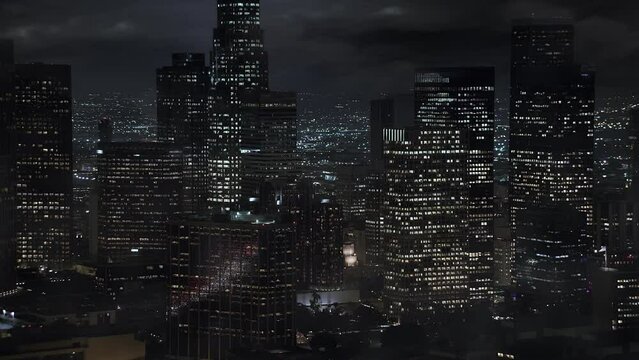 Close up Aerial View of Financial District LA with Thunderstorm. Lightning Storm Strike over Los Angeles City at Night. Climate Change.

