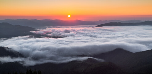 Panorama with amazing sunrise. Landscape with high mountains. Morning fog and dew. Touristic resort Carpathian national park, Ukraine Europe. Natural scenery.