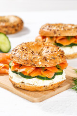 Bagel sandwich with salmon and cream cheese for breakfast portrait format