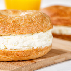 Bagel sandwich with cream cheese for breakfast close up square