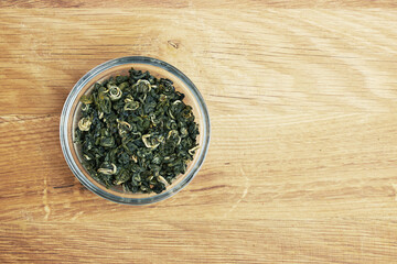 Tea in a bowl on a wood