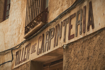 Brihuega, Spain - September 11, 2012. Old carpentry workshop with antique facade in Brihuega, Spain