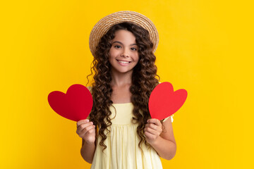 Young teenager child girl with heart shape. Happy Valentines Day. Love and pleasant feelings concept. Happy teenager, positive and smiling emotions of teen girl.