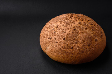 Fresh crispy brown bread with sesame seeds and spices