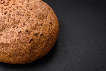 Fresh crispy brown bread with sesame seeds and spices