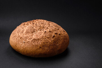 Fresh crispy brown bread with sesame seeds and spices