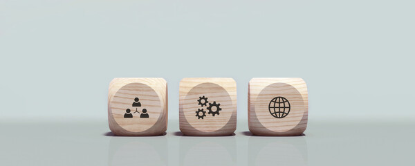 Conceptual business illustration with wooden cubes and icons on light blue background