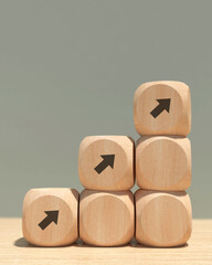 Conceptual business illustration with wooden cubes and icons. Business growth.