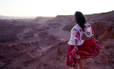 profile portrait mid adult latina woman in the Atacama desert with clothing inspired by...