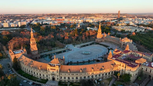 4k Aerial view of Plaza de Espana at sunrise in Seville, Spain. Night view of Maria Luisa Park