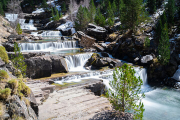 waterfall in the river in Ordesa National Park in the spanish Pyrenees (long exposure)