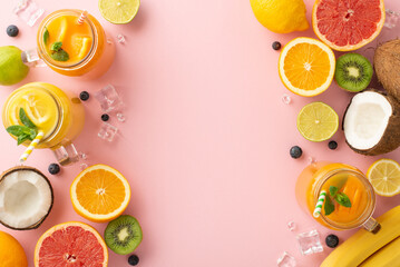 Get ready to beat the heat with this top view flat lay of citrus juices and cocktails featuring oranges, lemons, limes, and grapefruits, on a stylish pink background with blank space for advert