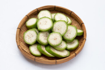 Raw banana slices on white background.