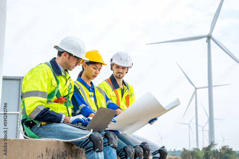 Aufkleber Engineer man looking and checking wind turbines at field,Wind turbine farm generator by alternative green energy.