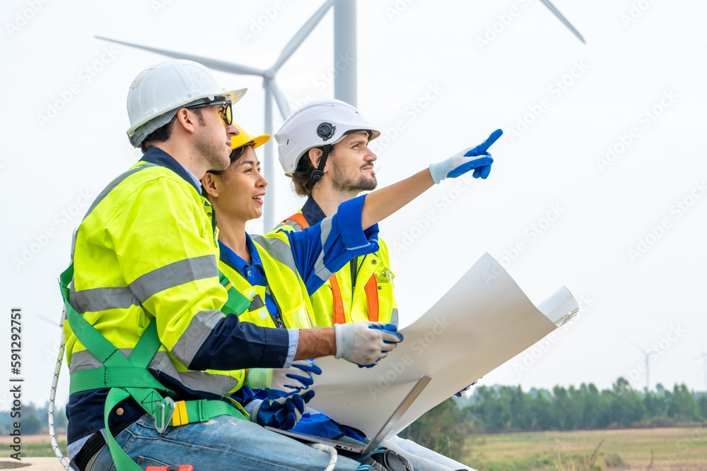 Poster technician engineer in uniform are checking wind turbine power farm, power generator station,clean e