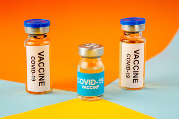 front view antivirus vaccine on orange-blue background lab drug covid- health science virus vaccine cure pandemic