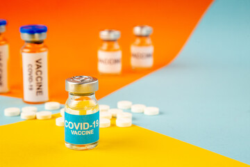 front view antivirus vaccines with pills on colorful background cure virus lab drug covid- health science hospital