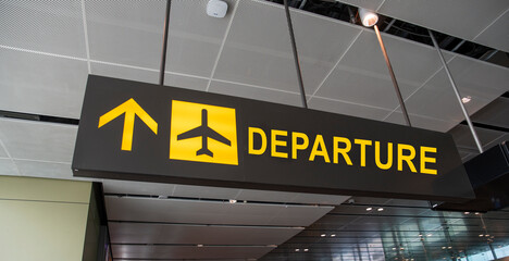 Departure airport sign - holiday and tourism concept