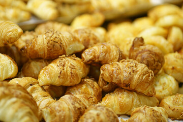 Sale of Cheese croissants and other pastries on the counter in the Supermarket in Surabaya, Indonesia.