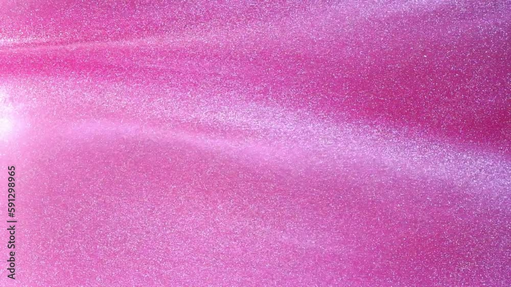 Wall mural slow motion of floating white particles in pink liquid. white glowing dust particles abstract motion