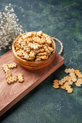 front view little crackers inside plate on a dark-gray background rusk crisp snack salt bread food cips color