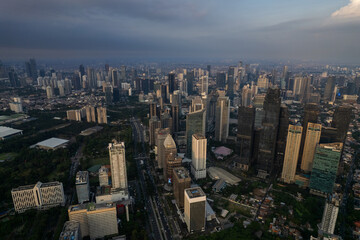 Fototapeta premium aerial photos of Sudirman street and Jakarta Skyline in the golden hour. 