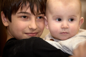 portrait of a baby, a boy in his arms
