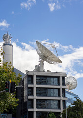 Huge television antenna disc on the roof of the building