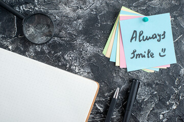 top view always smile note with pens and copybook on a gray background student paper college lesson...