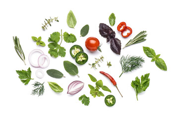 Composition with fresh herbs and vegetables isolated on white background