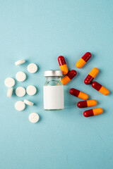 top view antivirus vaccine with pills on the blue background virus isolation color health pandemic covid- lab disease