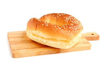 Wooden board of tasty bagel with cream cheese on white background